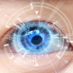 An eye looks out through a futuristic computer generated display of data analytics
